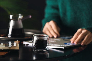 Fototapeta na wymiar Cup of hot turkish coffee on table, closeup