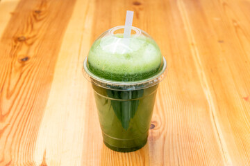 Green detox juice served in transparent take away container