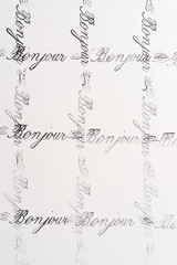 rubber stamp background with the french word bonjour