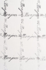 rubber stamp background with the french word bonjour © eugen