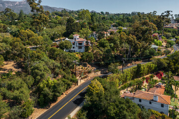 Real Estate on hills surrounded by green vegetation