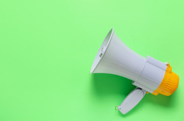 Modern megaphone on color background