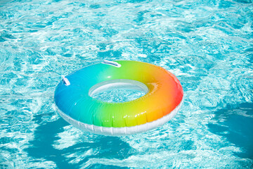 Pool ring in cool blue refreshing blue pool. Blue aqua textured background.