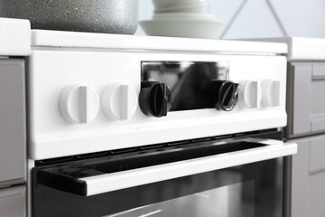 Modern electric stove in kitchen, closeup