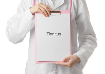 Female doctor holding clipboard with word TINNITUS on white background