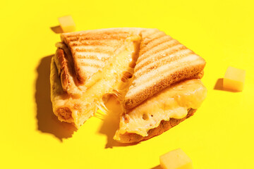 Tasty sandwiches with cheese on color background, closeup