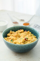 Bowl of tasty chicken curry on table