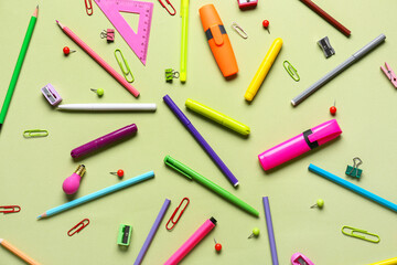 Stationery supplies on color background