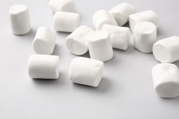 Tasty marshmallows on light background, closeup