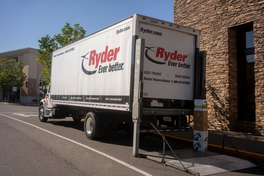 Tigard, OR, USA - Sep 8, 2021: A Ryder branded rental truck is seen in the Bridgeport Village Shopping Center in Tigard, Oregon. Ryder System, Inc. is an American transportation and logistics company.