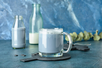 Glass cup of tasty Charcoal Latte on table