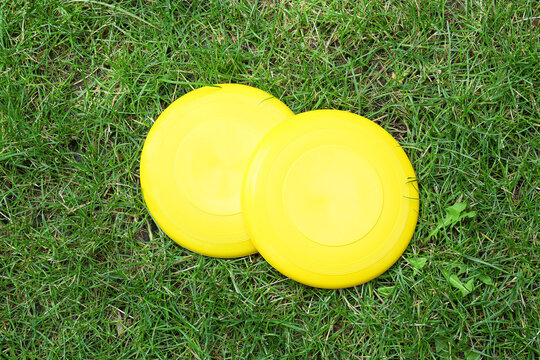 Frisbee disks on grass outdoors