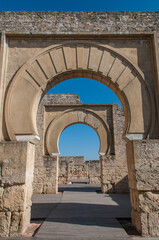 Fototapeta na wymiar Horseshoe arches. Restoration works on the ruins of the palatine city of Madinat Al-Zahra, Unesco World Heritage Site at Cordoba, Spain.