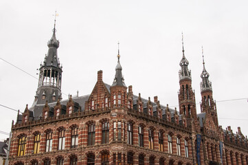 Fototapeta na wymiar Former Main Post Office building in Amsterdam, now a shopping mall. Neogothic - Neoreinassance style building.