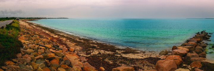 Panoramic seascape over the jetty on Cape Cod at rainy dusk
