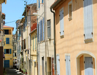Fototapeta na wymiar A beautiful view of the seaside town street buildings in Europe with its European architecture in La Ciotat, a city in French Riviera, the Mediterranean region of France and tropical destination.