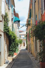 A beautiful view of the seaside town street buildings in Europe with its European architecture in La Ciotat, a city in French Riviera, the Mediterranean region of France and tropical destination. - obrazy, fototapety, plakaty