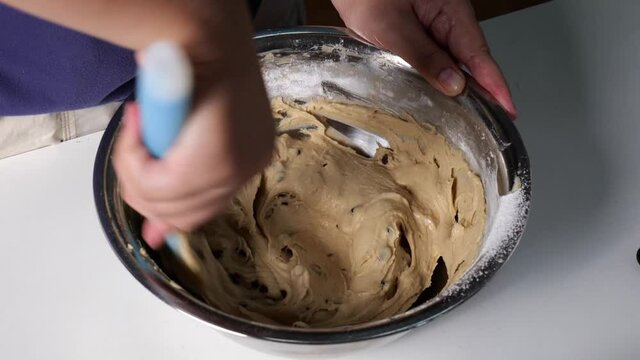 Use a spatula to mix the dough into slow motion cookies.