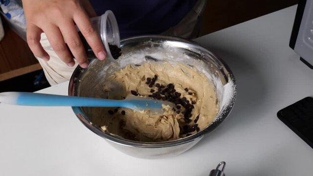Add chocolate chips and mix to make slow motion cookies.