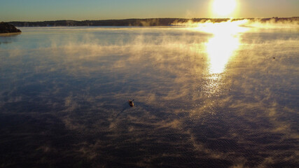 canoe over a lake at sunrise