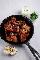 Baked chicken wings with garlic sauce