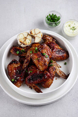 Baked chicken wings with garlic sauce