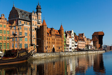 Obraz premium Motlawa river embankment in historical part of Gdansk at sunny day, Poland