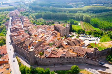 View from drone of spanish village Hostalric with Parish church of Santa Maria