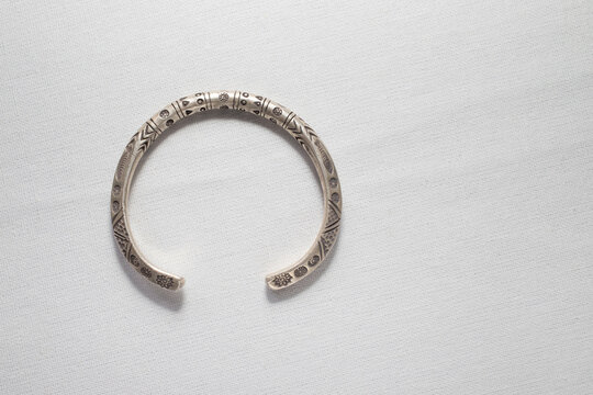 Antique Real Silver Bangle On White Cloth Background