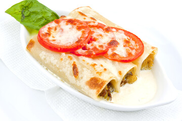 Pasty hot lasagna served with a basil leaf on a gray plate. Italian cuisine, menu, recipe. Homemade meat lasagna. Copy space for text, top view
