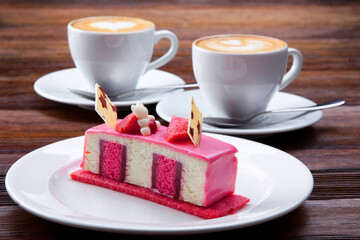 cuppuccino with delicious dessert on a wooden table
