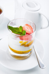 delicious sweet dessert on white plate with tea
