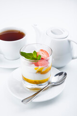 delicious sweet dessert on white plate with tea
