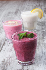 bright berry and fruit smoothies on a white background