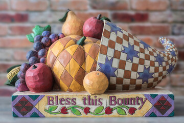  wooden horn of plenty with patchwork fruit and Thanksgiving concept blessing