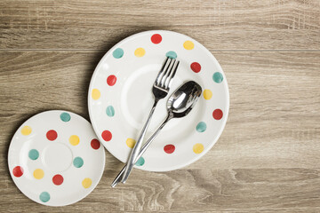 Polka pot plate on a wooden table.