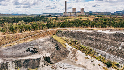 Horizontal shot of a tipper truck near Stanwell power station and ash piles