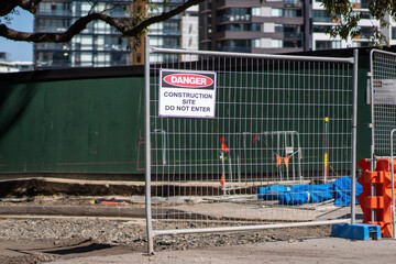 Sign at entrance of construction site say "Danger Construction site Do not Enter"