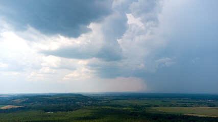 Panoramic landscape sky, stormy rain clouds, rain, land, forest