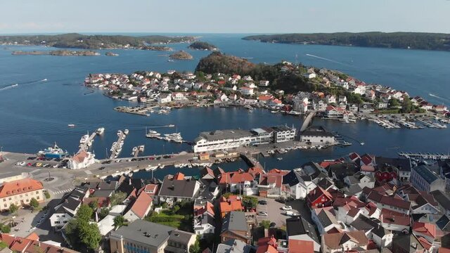 Cinematic reveal of popular Kragero coastal town in Scandinavia; drone view