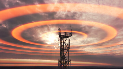 Wireless telecom radiation with aerial footage. Silhouette of telecommunication tower construction with antenna dishes on red sunset. Mobile digital radio waves animation from the high cellular mast. - obrazy, fototapety, plakaty