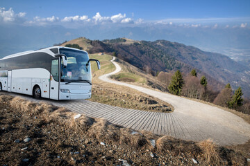 coach bus  on a panoramic road in the hills