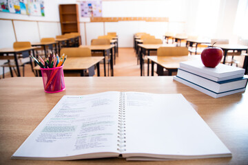 Pencils and books in the classroom. Education concept.