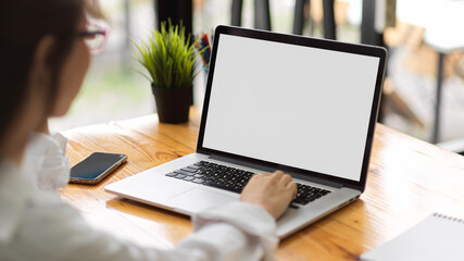 Close up view of laptop computer screen mockup using by female