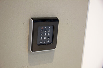 The smart home system with access control for fingerprint, key, NFC tags, enter a PIN code. Touch sensor keyboard on the wall at home