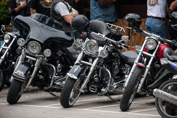 Obraz na płótnie Canvas cool black motorcycles in the parking lot at the bar