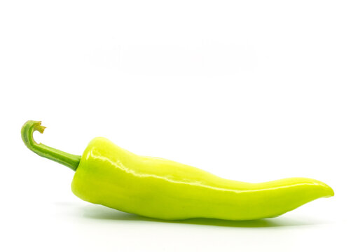 Side View Of One Green Pepper Or Banana Peppers On White Background.