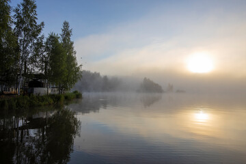 Naklejka na ściany i meble Dawn by the river in the summer season. Beautiful landscape of morning freshness.