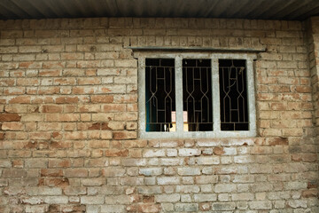 Fototapeta na wymiar Brick wall with window silhouette 