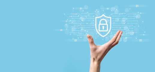Protection network security computer and safe your data concept, Businessman holding shield protect icon. lock symbol, concept about security, cybersecurity and protection against dangers © Ivan